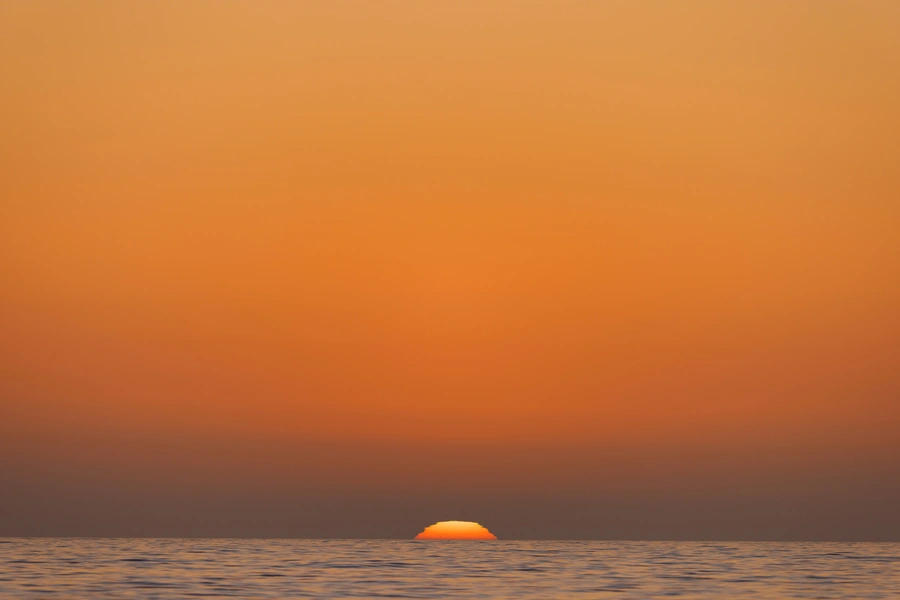 The sun sets on the Pacific Ocean in Encinitas, California, on August 28, 2023.